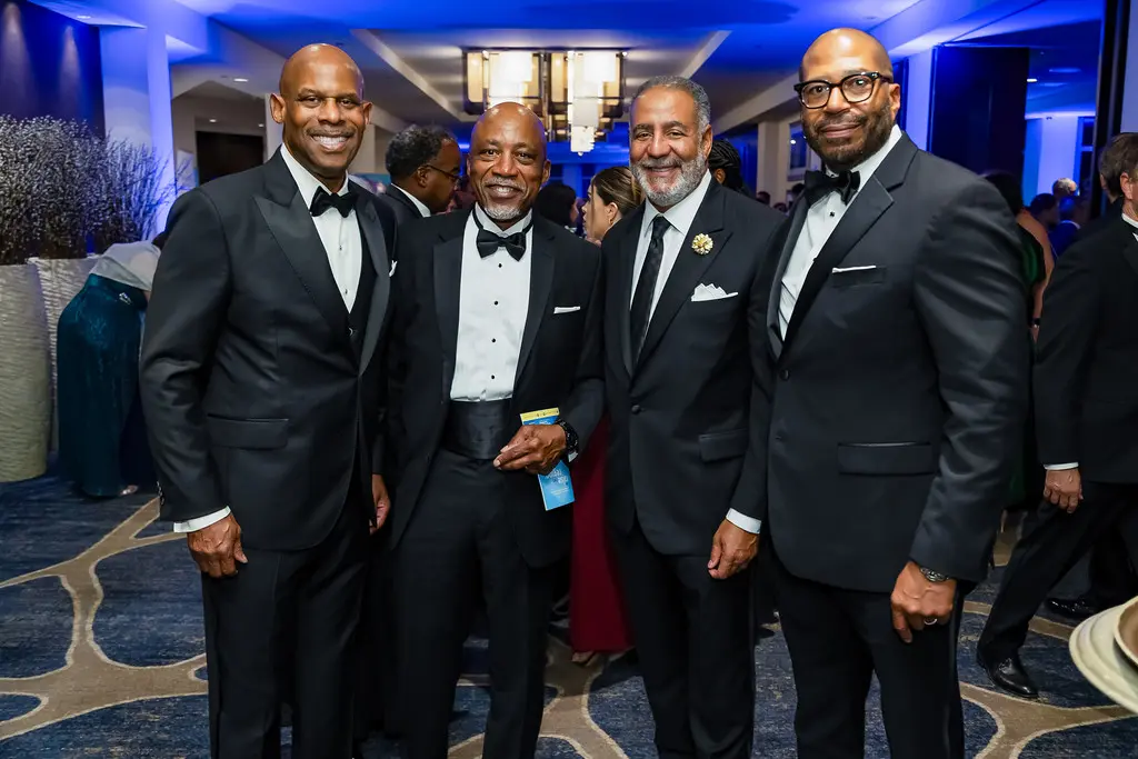 Guests gathered at a formal high-visibility evening event.
